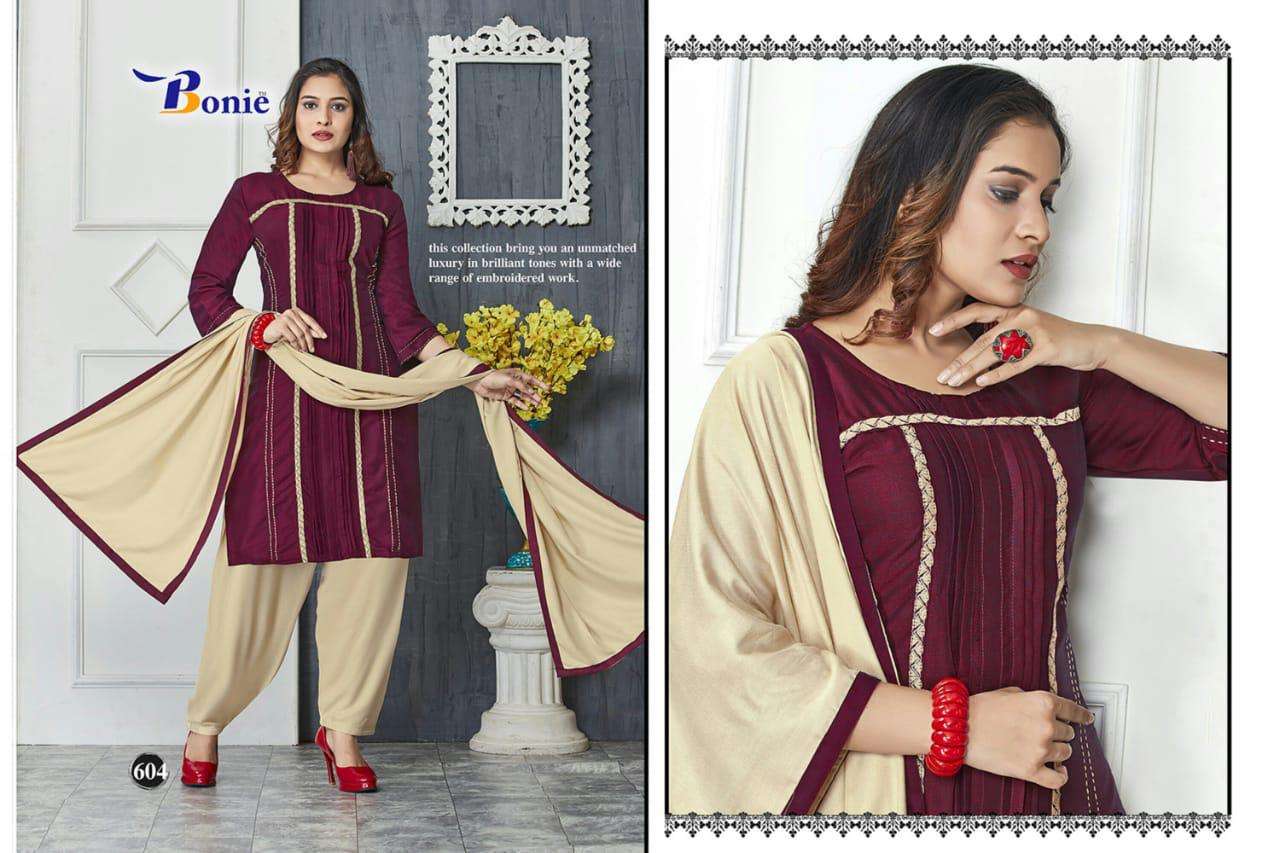NAIRA BY BONIE 601 TO611 SERIES SUITS STYLISH BEAUTIFUL COLOURFUL PRINTED & EMBROIDERED PARTY WEAR & OCCASIONAL WEAR HEAVY RAYON 14 KG DRESSES AT WHOLESALE PRICE