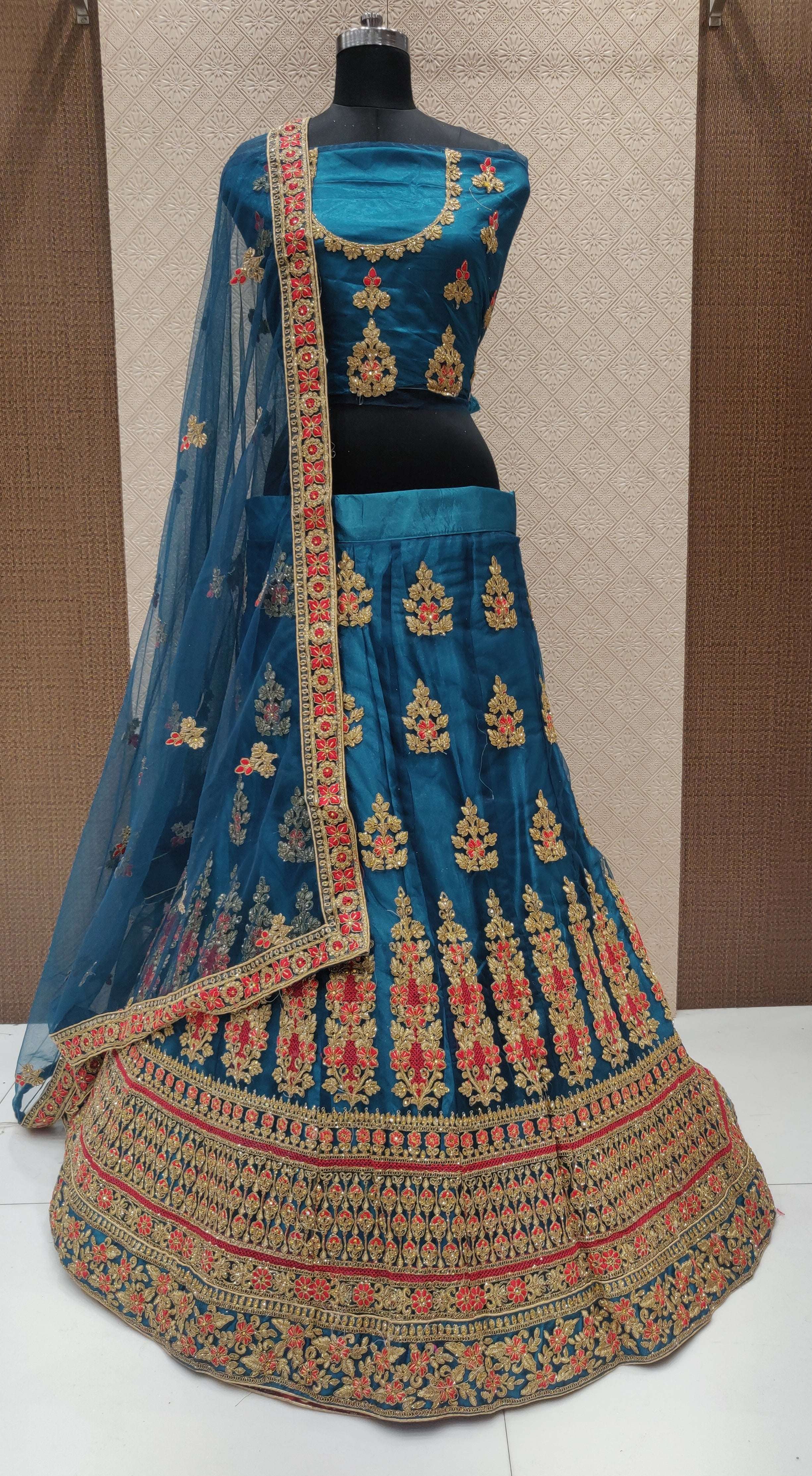 RANGMANCH BY FASHID WHOLESALE 1001 TO 1004 SERIES INDIAN DESIGNER TRADITIONAL WEAR COLLECTION BEAUTIFUL STYLISH FANCY COLORFUL PARTY WEAR & OCCASIONAL WEAR NET LEHENGAS AT WHOLESALE PRICE