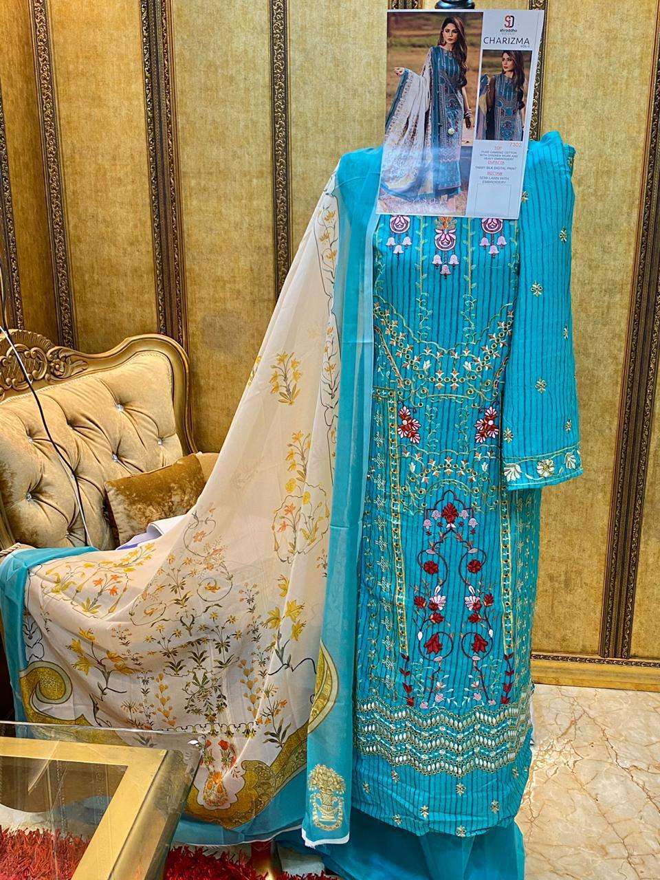 CHARIZMA VOL-3 BY SHRADDHA DESIGNER 7301 TO 7304 SERIES BEAUTIFUL WINTER COLLECTION SUITS STYLISH FANCY COLORFUL CASUAL WEAR & ETHNIC WEAR PURE CAMBRIC COTTON WITH EMBROIDERY DRESSES AT WHOLESALE PRICE