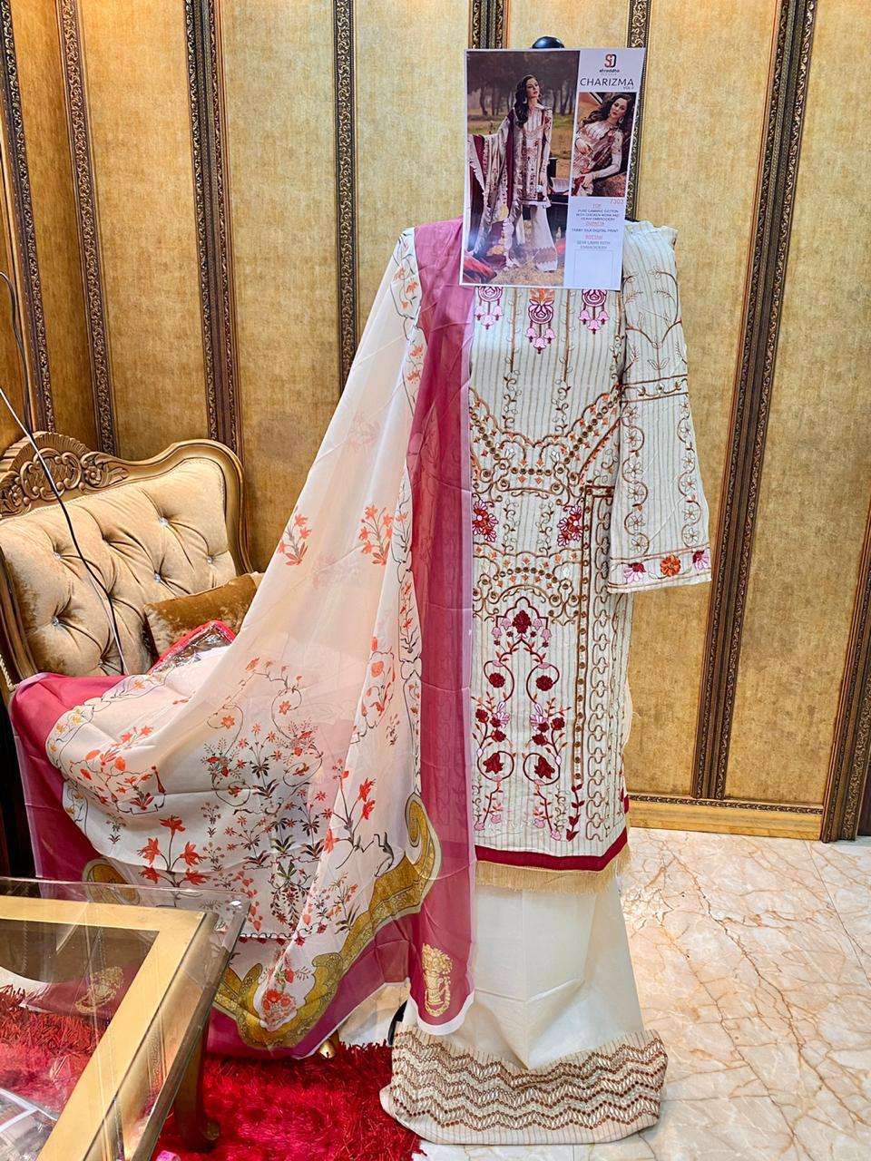 CHARIZMA VOL-3 BY SHRADDHA DESIGNER 7301 TO 7304 SERIES BEAUTIFUL WINTER COLLECTION SUITS STYLISH FANCY COLORFUL CASUAL WEAR & ETHNIC WEAR PURE CAMBRIC COTTON WITH EMBROIDERY DRESSES AT WHOLESALE PRICE