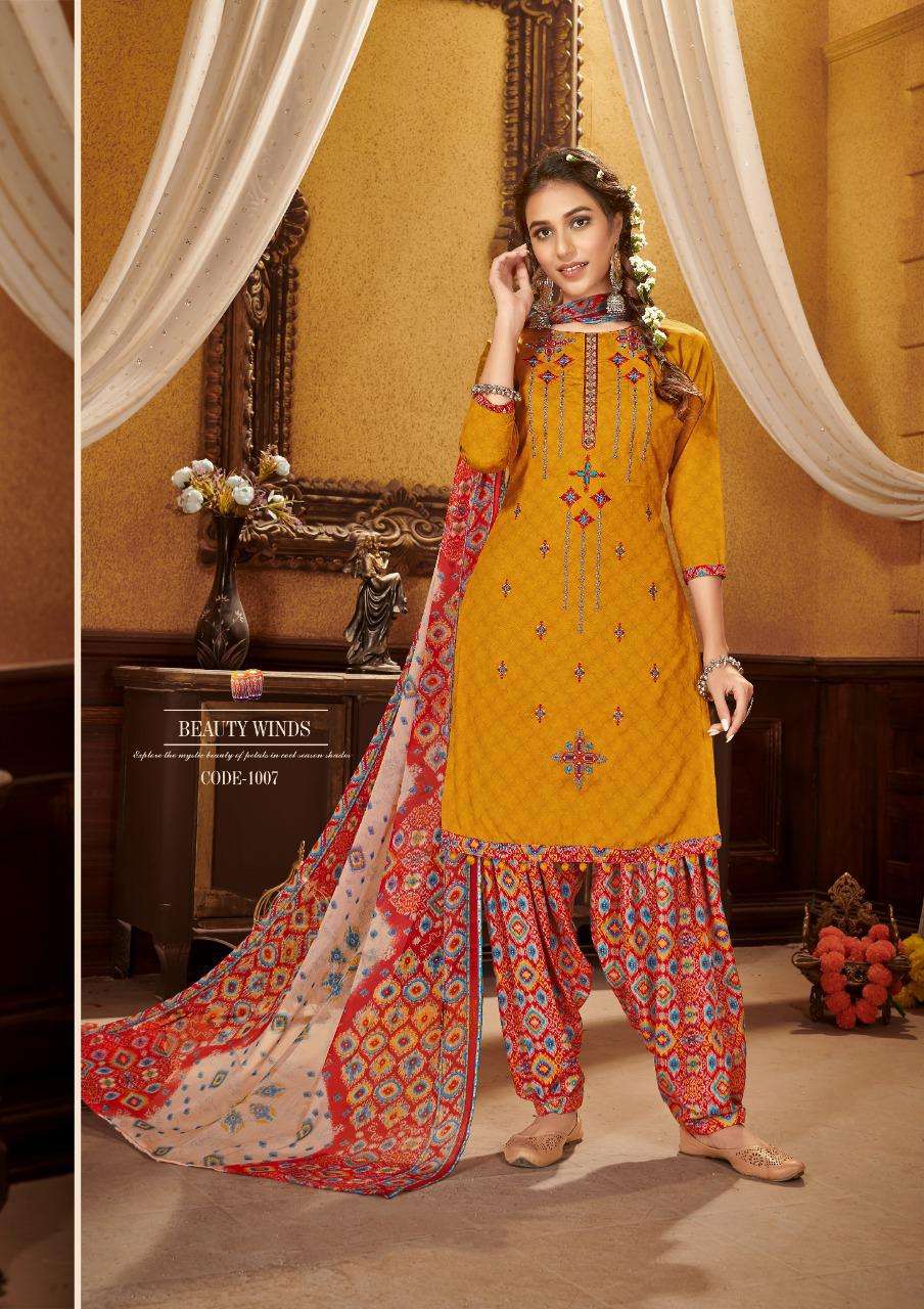 KUDI PATOLA BY ROLI MOLI 1001 TO 1008 SERIES BEAUTIFUL SUITS COLORFUL STYLISH FANCY CASUAL WEAR & ETHNIC WEAR COTTON NAGITIVE PRINT WITH EMBROIDERY WORK DRESSES AT WHOLESALE PRICE