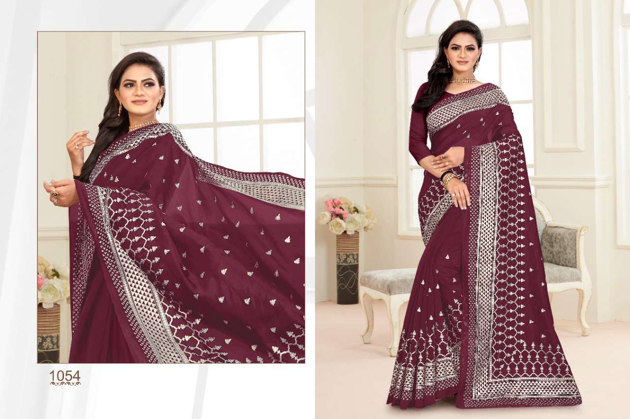 CRYSTA BY BALARKAS 1051 TO 1054 SERIES INDIAN TRADITIONAL WEAR COLLECTION BEAUTIFUL STYLISH FANCY COLORFUL PARTY WEAR & OCCASIONAL WEAR SOFT ORGANZA FOIL PRINT SAREES AT WHOLESALE PRICE