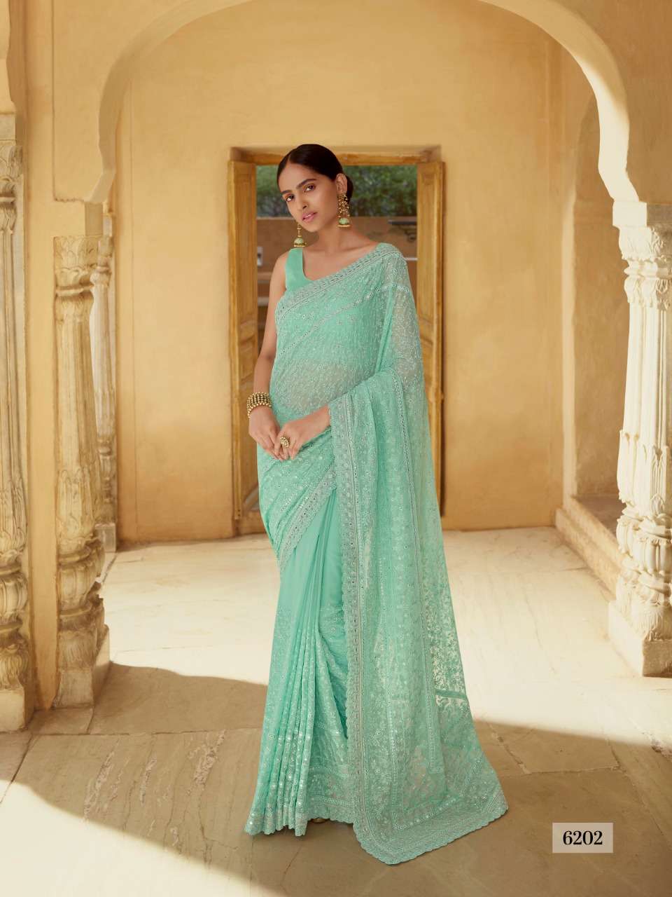 SWARNA BY ARYA DESIGNS 6201 TO 6216 SERIES INDIAN TRADITIONAL WEAR COLLECTION BEAUTIFUL STYLISH FANCY COLORFUL PARTY WEAR & OCCASIONAL WEAR SOFT NET/GEORGETTE SAREES AT WHOLESALE PRICE