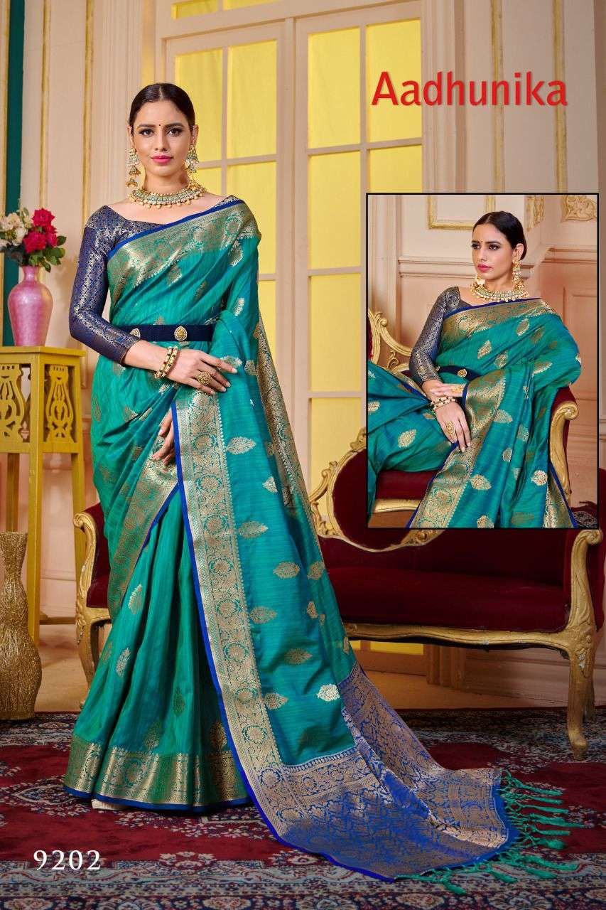 AADHUNIKA BY RAJYOG 9201 TO 9206 SERIES INDIAN TRADITIONAL WEAR COLLECTION BEAUTIFUL STYLISH FANCY COLORFUL PARTY WEAR & OCCASIONAL WEAR SOFT SILK SAREES AT WHOLESALE PRICE