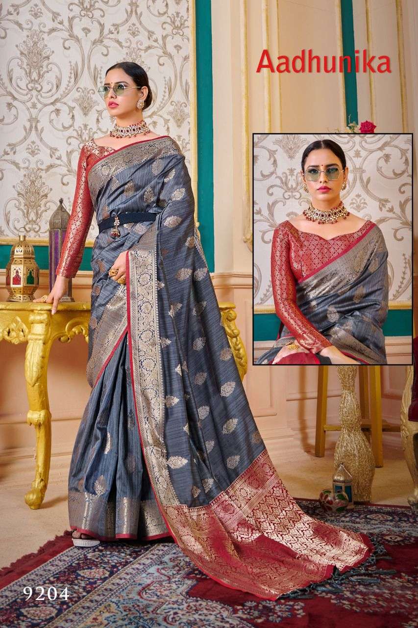 AADHUNIKA BY RAJYOG 9201 TO 9206 SERIES INDIAN TRADITIONAL WEAR COLLECTION BEAUTIFUL STYLISH FANCY COLORFUL PARTY WEAR & OCCASIONAL WEAR SOFT SILK SAREES AT WHOLESALE PRICE