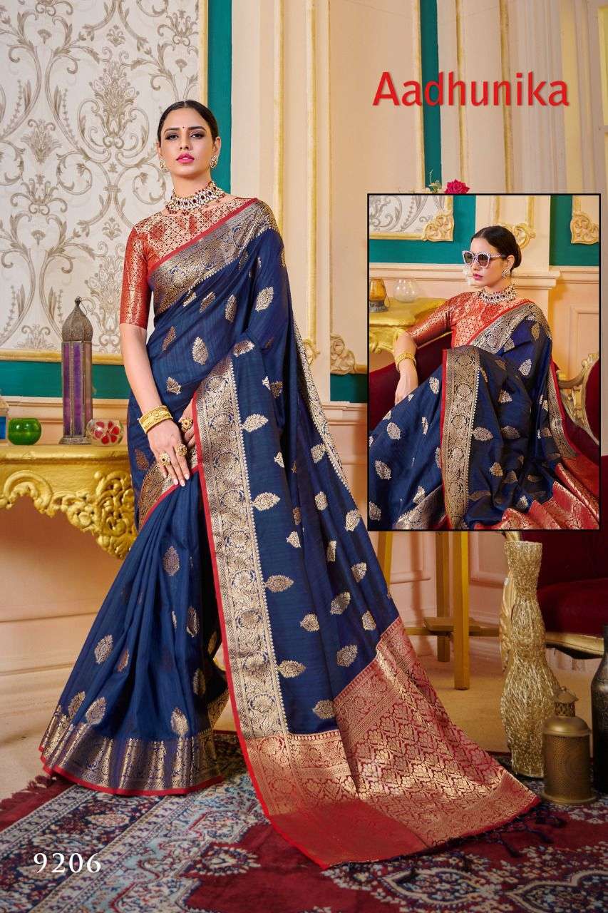 AADHUNIKA BY RAJYOG 9201 TO 9206 SERIES INDIAN TRADITIONAL WEAR COLLECTION BEAUTIFUL STYLISH FANCY COLORFUL PARTY WEAR & OCCASIONAL WEAR SOFT SILK SAREES AT WHOLESALE PRICE