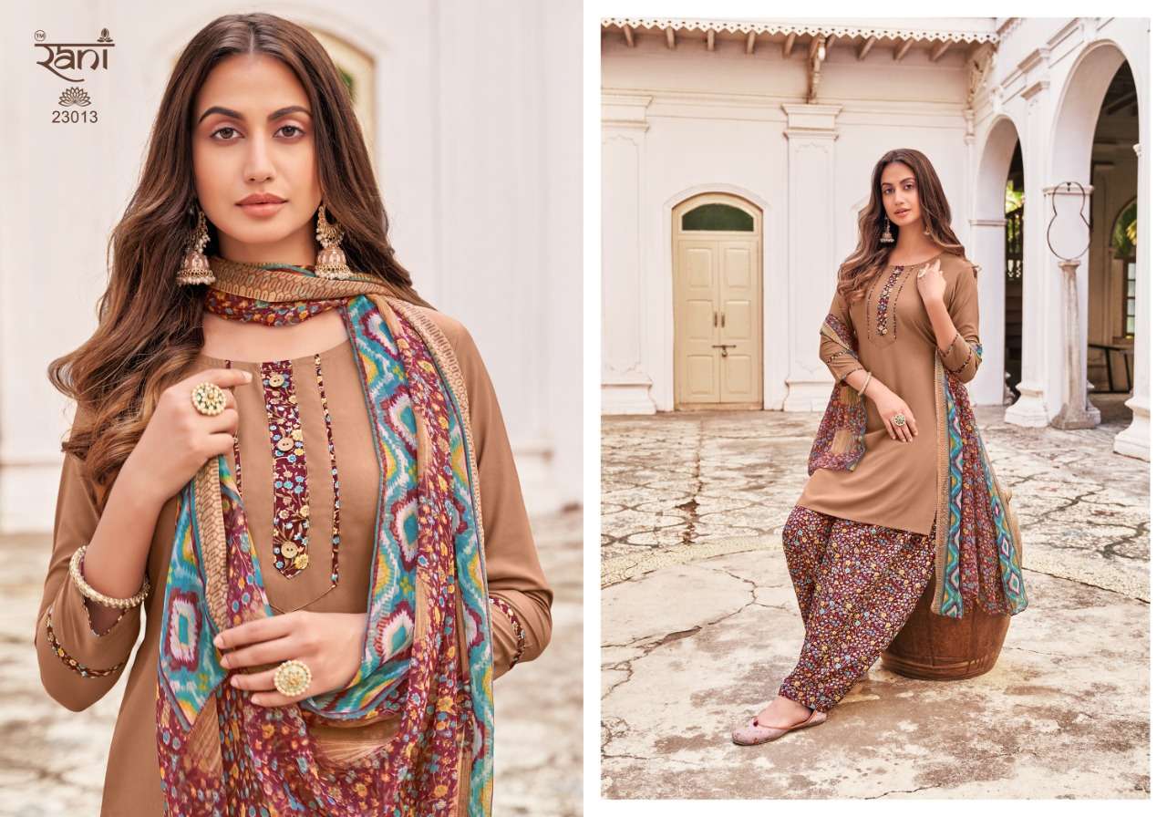 SUNHERI VOL-23 BY RANI FASHION 23001 TO 23016 SERIES BEAUTIFUL STYLISH SUITS FANCY COLORFUL CASUAL WEAR & ETHNIC WEAR & READY TO WEAR HEAVY AMERICAN CREPE PRINTED DRESSES AT WHOLESALE PRICE