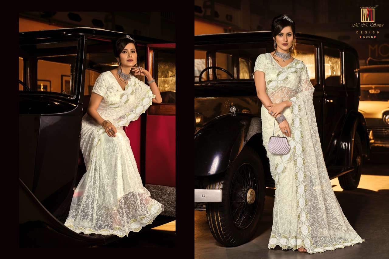 SWAROVSKI VOL-3 BY M N SAREES 6001 TO 6015 SERIES INDIAN TRADITIONAL WEAR COLLECTION BEAUTIFUL STYLISH FANCY COLORFUL PARTY WEAR & OCCASIONAL WEAR NET SAREES AT WHOLESALE PRICE