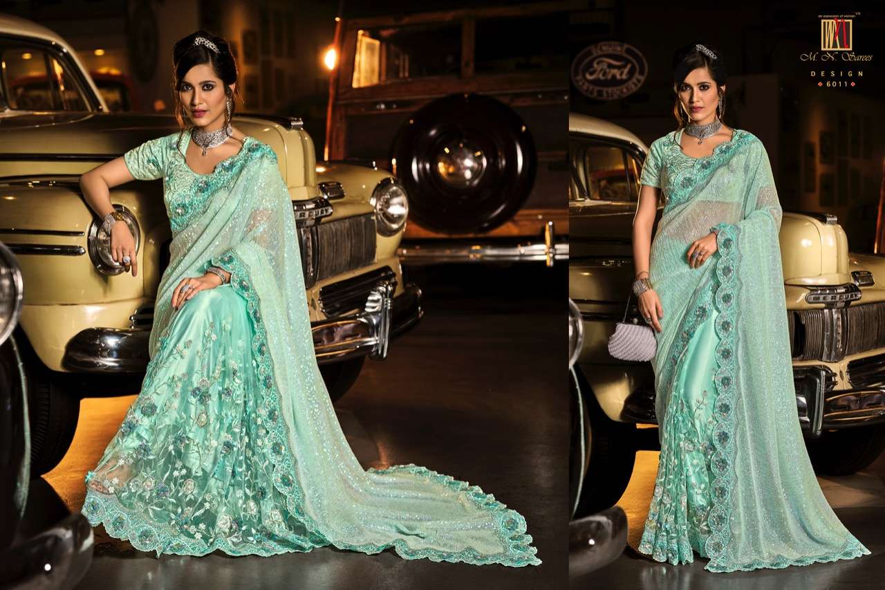 SWAROVSKI VOL-3 BY M N SAREES 6001 TO 6015 SERIES INDIAN TRADITIONAL WEAR COLLECTION BEAUTIFUL STYLISH FANCY COLORFUL PARTY WEAR & OCCASIONAL WEAR NET SAREES AT WHOLESALE PRICE