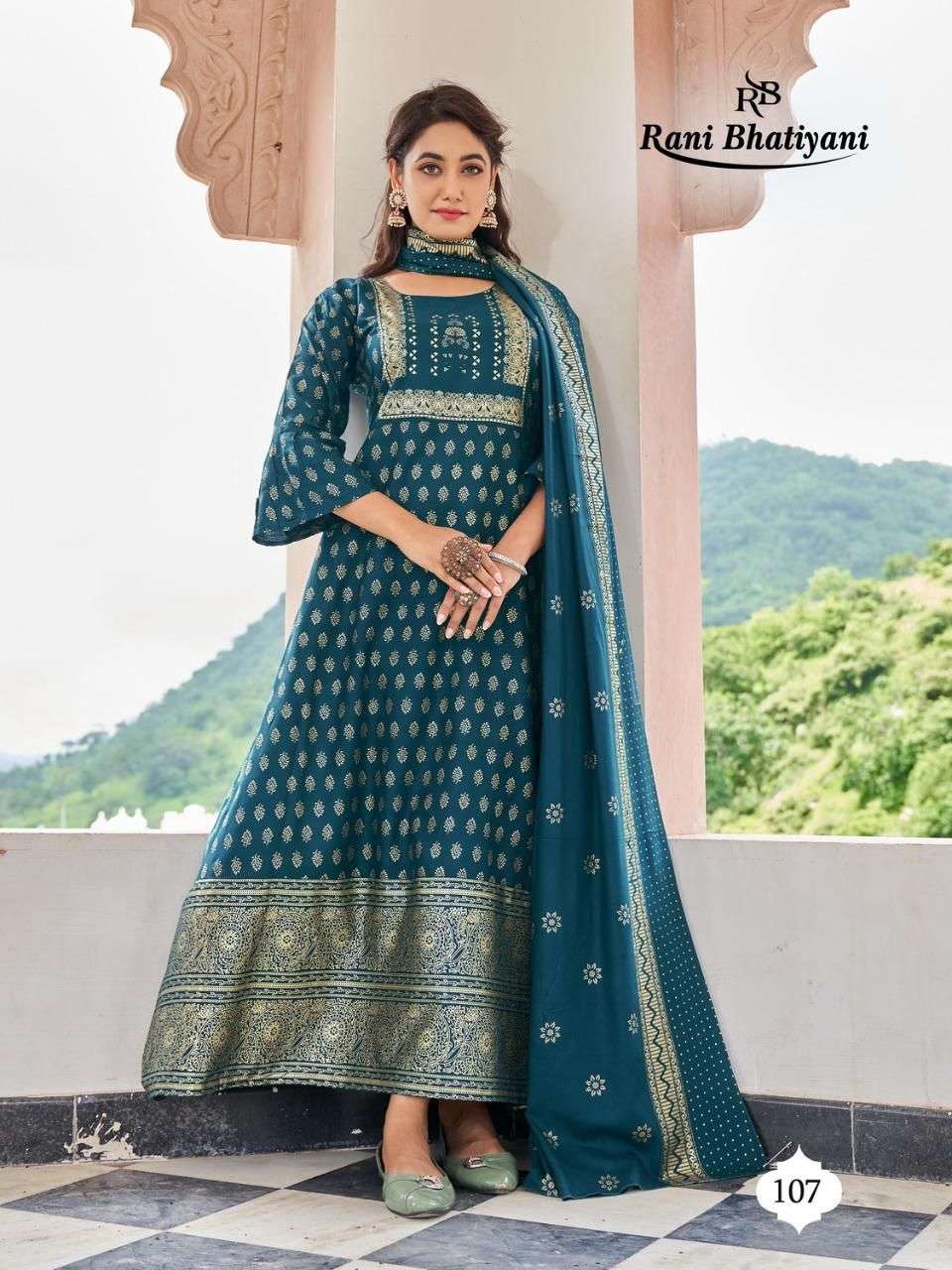 STUDIO BY RANI BHATIYANI 101 TO 108 SERIES BEAUTIFUL STYLISH FANCY COLORFUL CASUAL WEAR & ETHNIC WEAR RAYON FOIL PRINT GOWNS WITH DUPATTA AT WHOLESALE PRICE