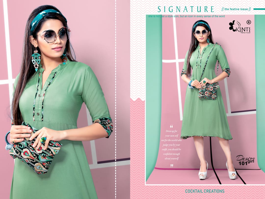 Desi Girl Vol-1 By Kinti 101 To 112 Series Indian Traditional Wear Collection Beautiful Stylish Fancy Colorful Party Wear & Occasional Wear Rayon Print Kurtis With Purse At Wholesale Price