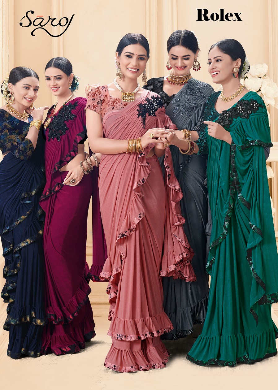 Rolex By Saroj Saree 01 To 06 Series Indian Traditional Wear Collection Beautiful Stylish Fancy Colorful Party Wear & Occasional Wear Heavy Lycrea With Brooch Pallu Sarees At Wholesale Price